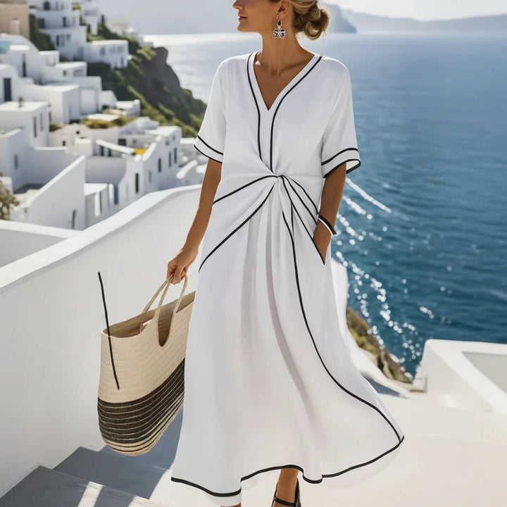Women's maxi dress with V-neck and twisted front.