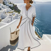 Women's maxi dress with V-neck and twisted front.
