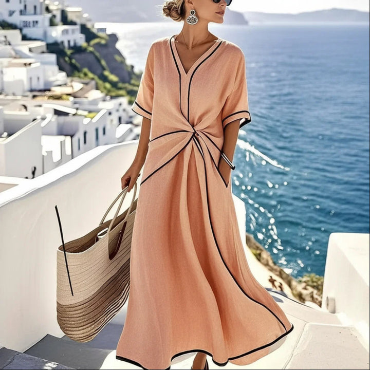 Women's maxi dress with V-neck and twisted front.