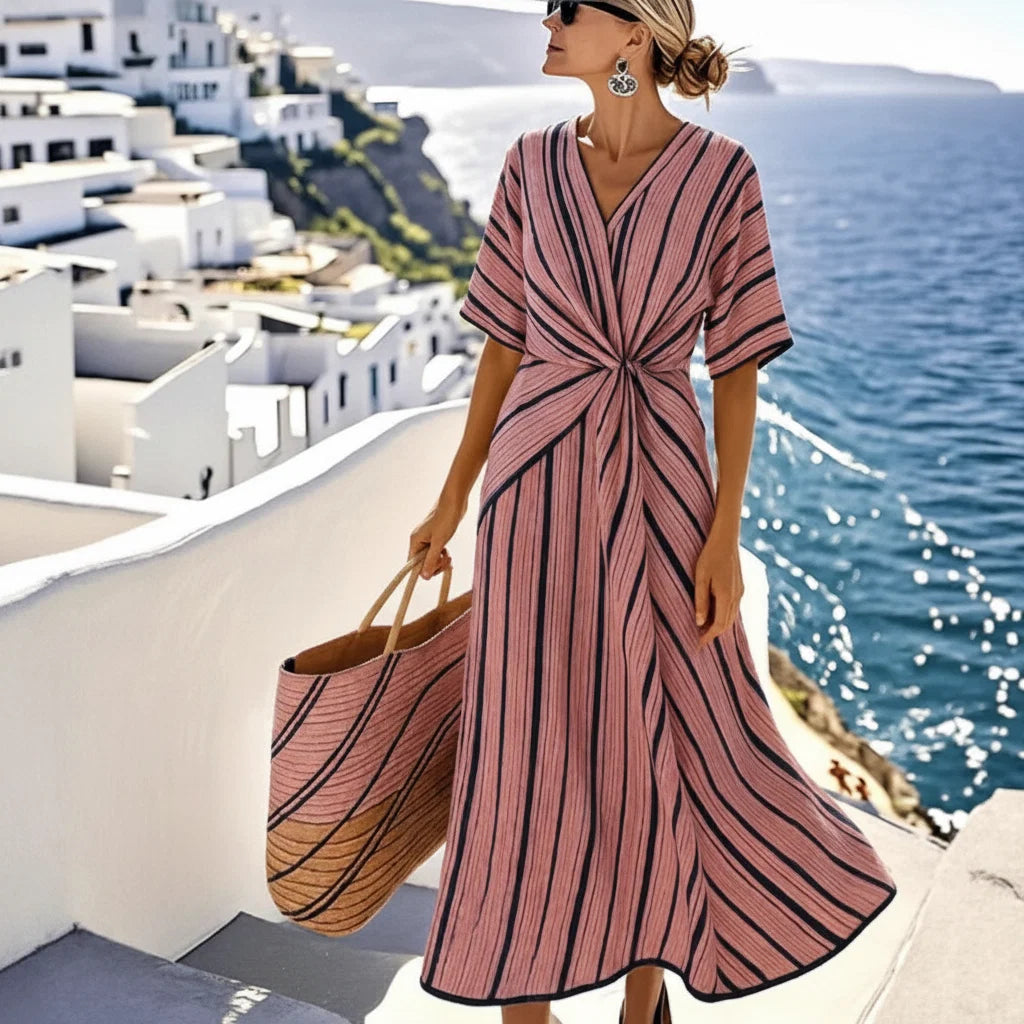 Women's maxi dress with V-neck and twisted front.