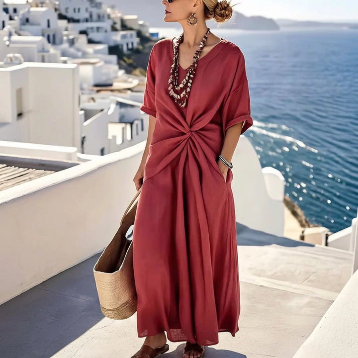 Women's maxi dress with V-neck and twisted front.