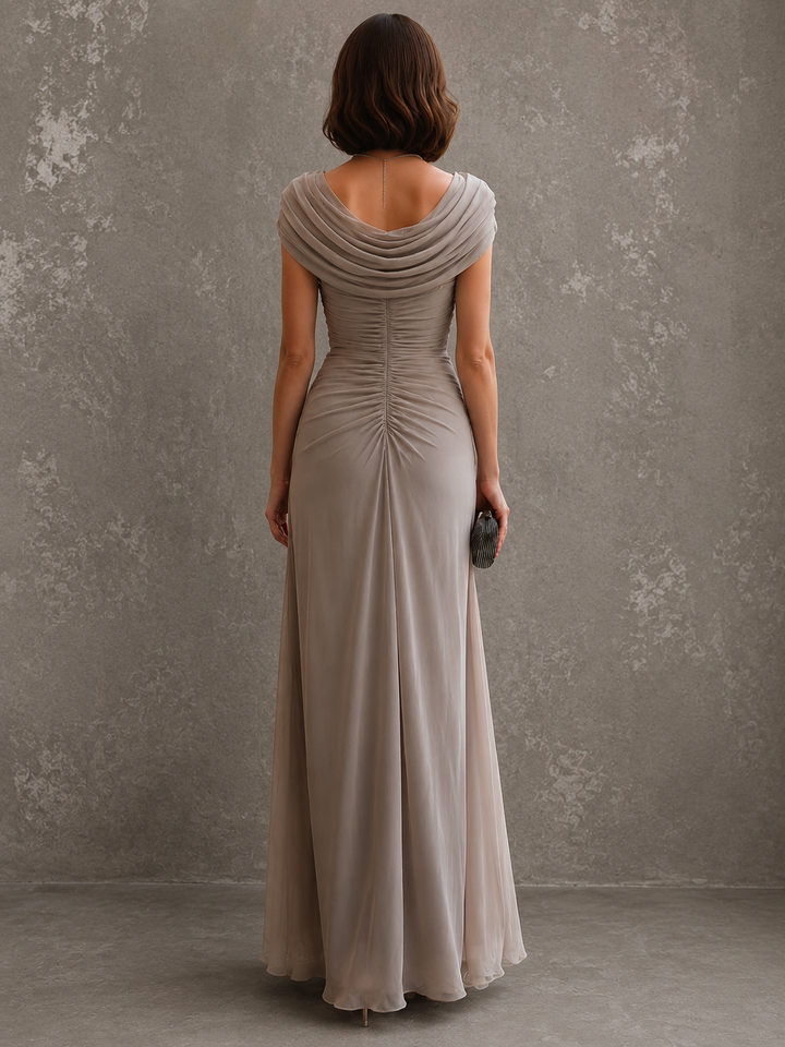 Draped sleeveless maxi dress with flowing floor-length skirt