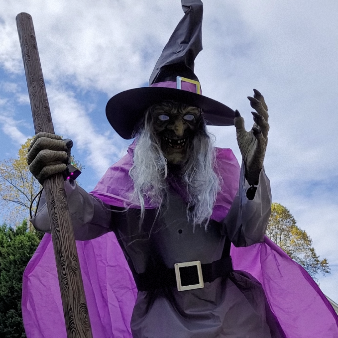 Life-Size Flying Witch Halloween Decor and Prop with Glowing LED Eyes and Broomstick Stand