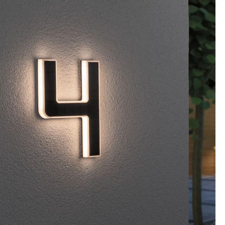 Solar-lit house number with LED and dusk sensor